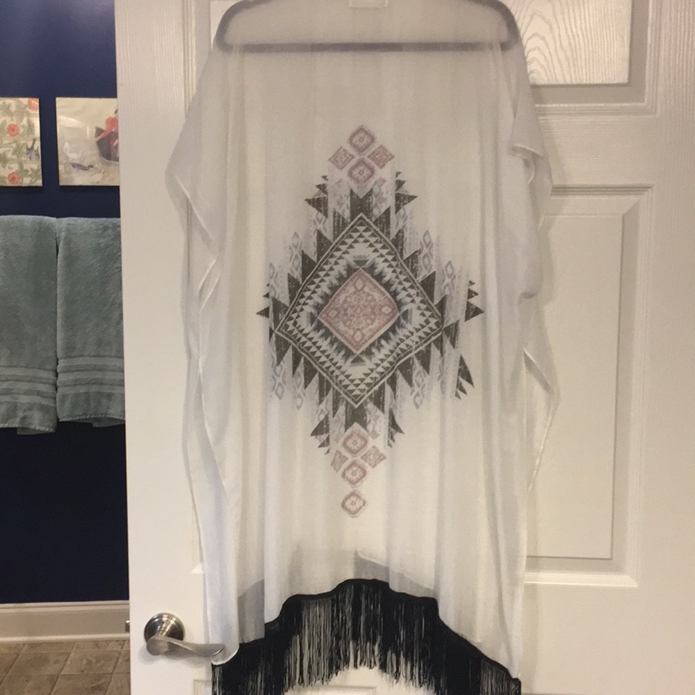 White poncho with black fringe